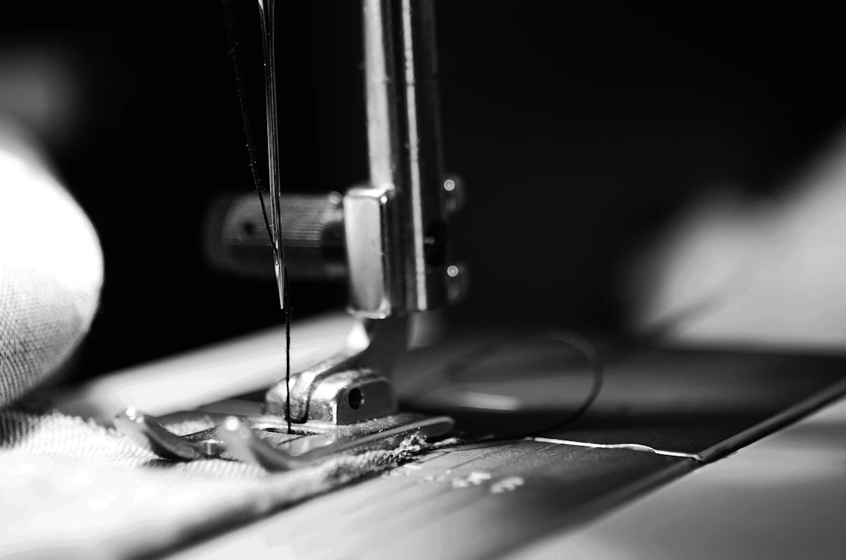 Close detail of expert stitching on fine bespoke fabric