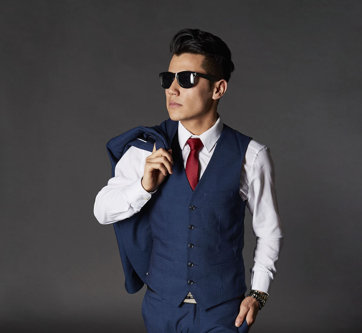 A bespoke waistcoat in deep navy with gold button details